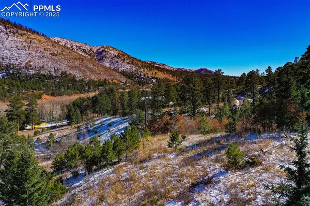 a view of a city with mountains in the background