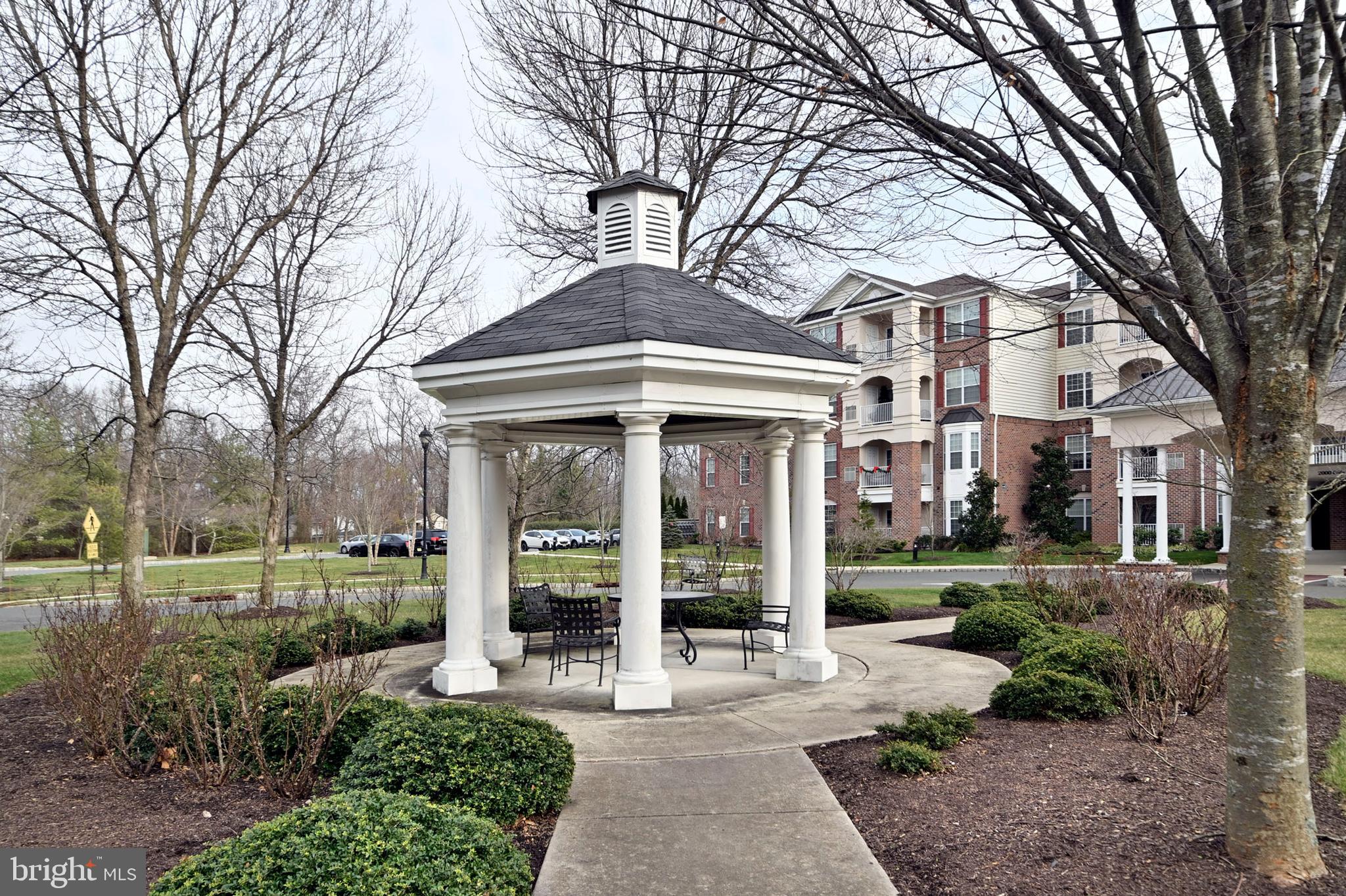 1315 Colts Circle, Unit G Trenton, NJ 08648 - Photo 11 of 12 a view of a building with a garden
