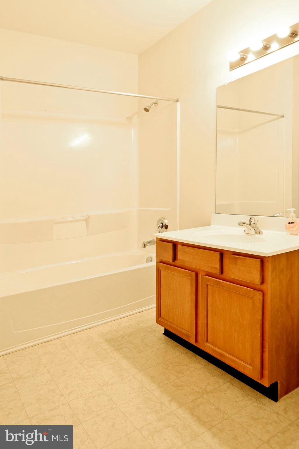 1315 Colts Circle, Unit G Trenton, NJ 08648 - Photo 7 of 12 a bathroom with a sink and a mirror