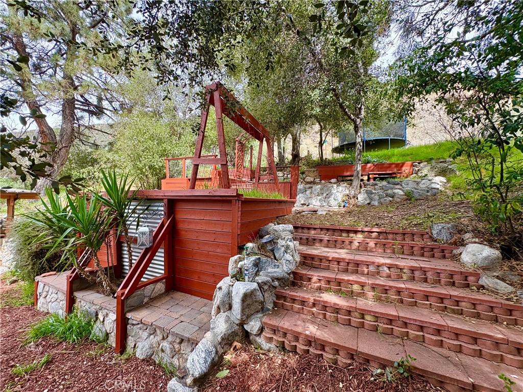 36750 Hilltop Road Yucaipa, CA 92399 - Photo 5 of 27 a front view of a house with a yard