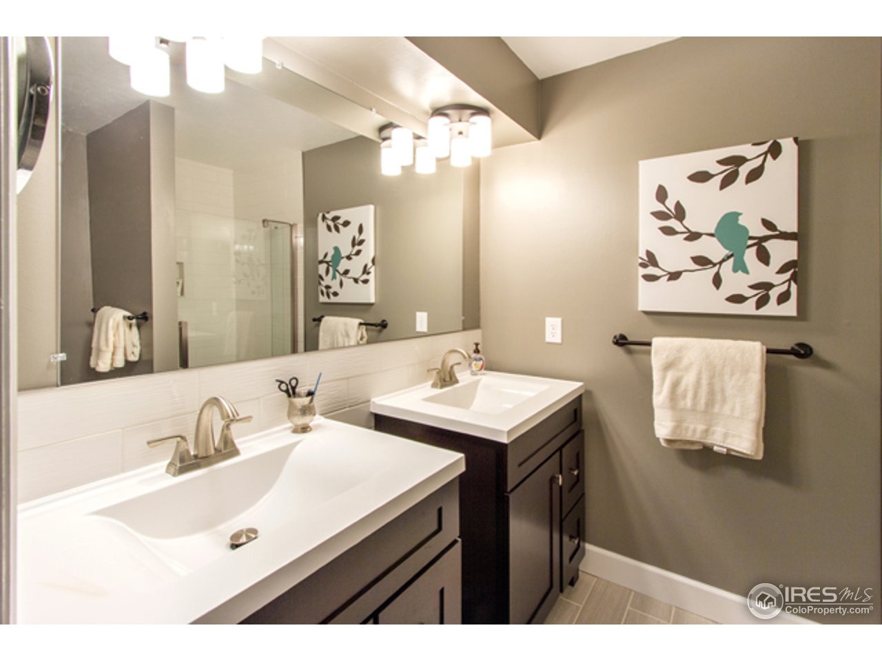 1105 Lin Mar Drive Fort Collins, CO 80521 - Photo 19 of 29 a bathroom with a sink and a mirror