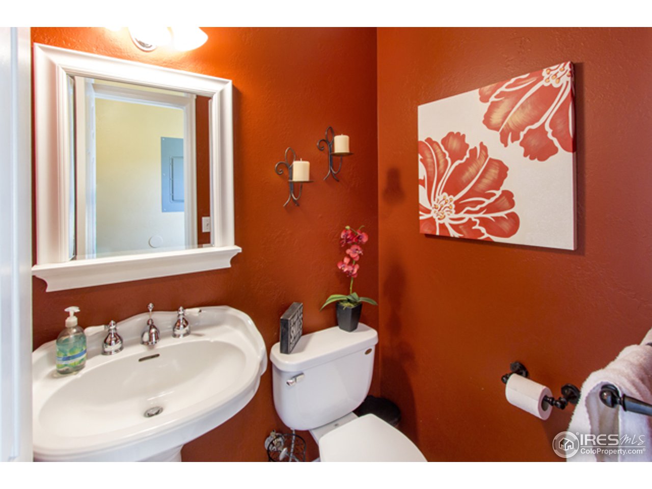 1105 Lin Mar Drive Fort Collins, CO 80521 - Photo 20 of 29 a bathroom with a toilet sink and mirror