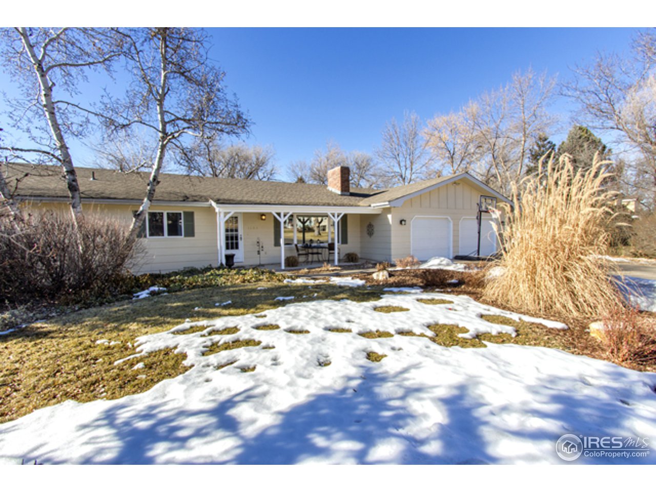 1105 Lin Mar Drive Fort Collins, CO 80521 - Photo 2 of 29 a view of a yard with a house