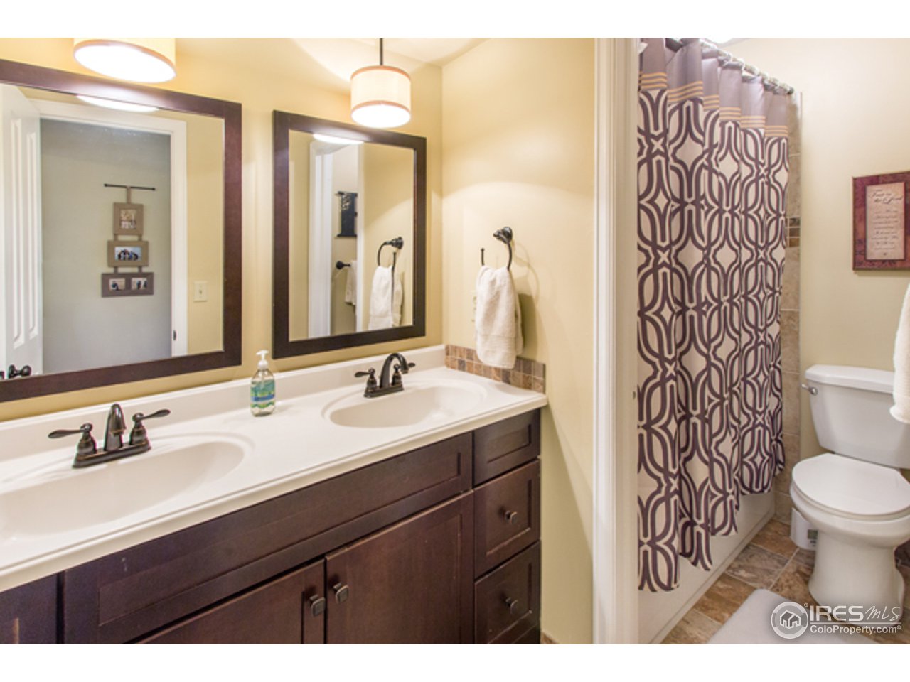 1105 Lin Mar Drive Fort Collins, CO 80521 - Photo 23 of 29 a bathroom with a sink and a mirror