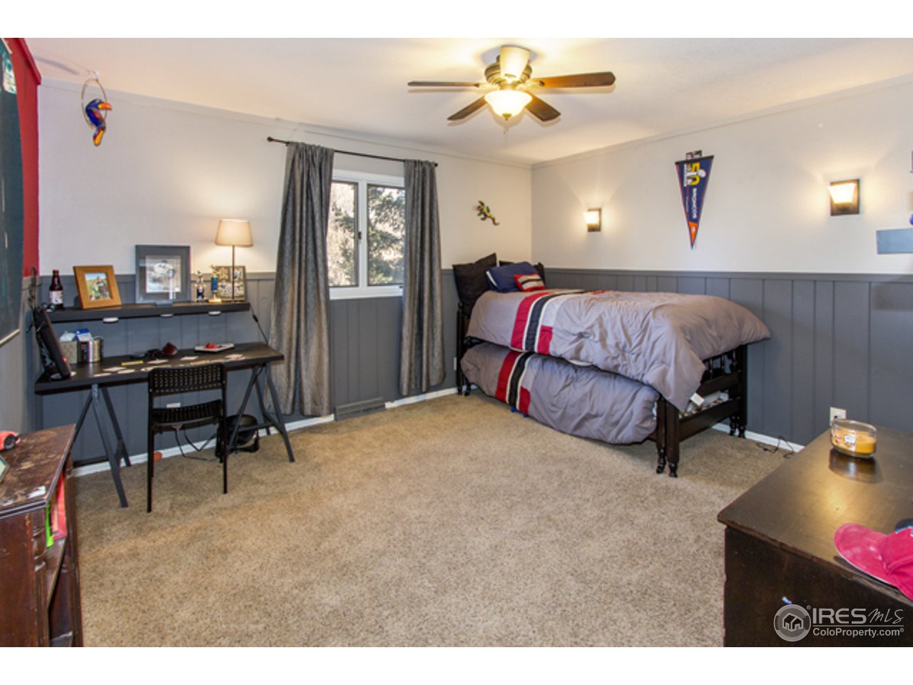 1105 Lin Mar Drive Fort Collins, CO 80521 - Photo 24 of 29 a living room with a bed furniture and a window