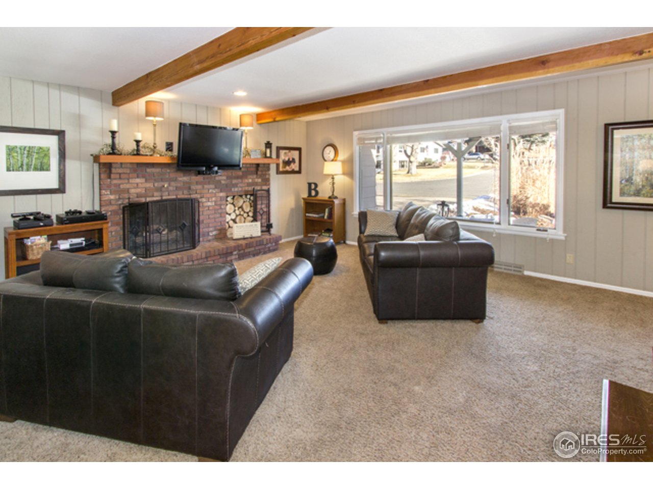 1105 Lin Mar Drive Fort Collins, CO 80521 - Photo 6 of 29 a living room with furniture and a fireplace