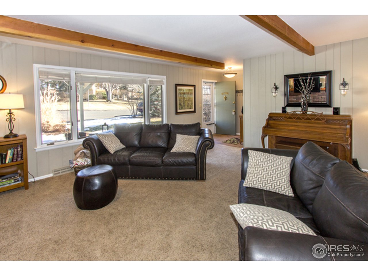1105 Lin Mar Drive Fort Collins, CO 80521 - Photo 7 of 29 a living room with furniture and a flat screen tv