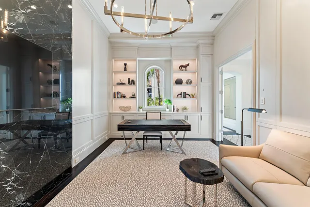 a bathroom with a granite countertop sink mirror and toilet