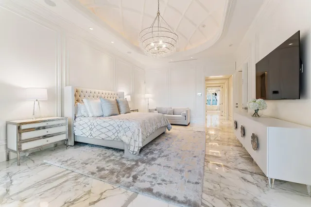 a bathroom with a sink mirror and vanity