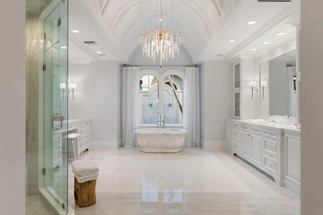 a bathroom with a granite countertop sink mirror and double