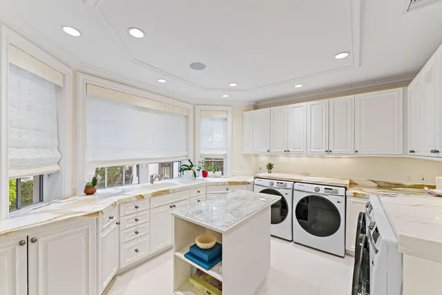 a kitchen with granite countertop a sink and a microwave