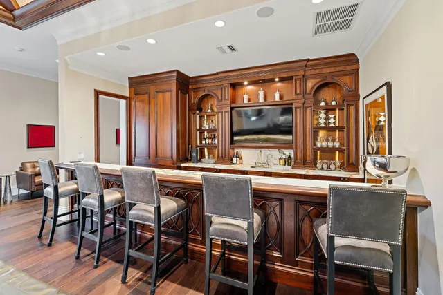 a front view of a house with swimming pool and porch
