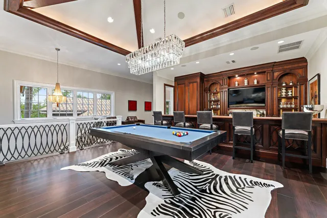 a outdoor space with patio the couches and a fireplace with the potted plants