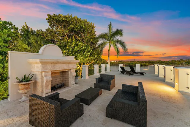 a kitchen with furniture and wooden floor