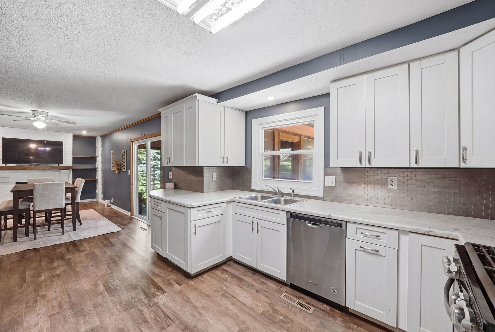 5645 Beebe Drive Rochelle, IL 61068 - Photo 14 of 43 a kitchen with white cabinets and sink