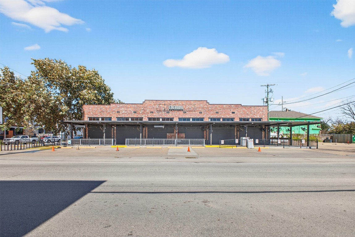 2416 Whitney Street Houston, TX 77006 - Photo 5 of 13 a view of a building and a cars park