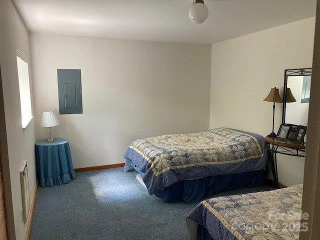 a bedroom with a bed and tv