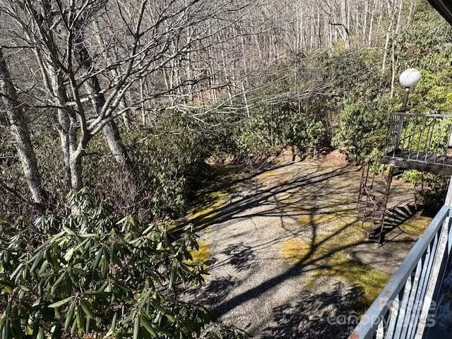 a view of a chairs and table in patio