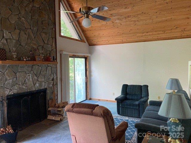 860 Pless Underwood Road Maggie Valley, NC 28751 - Photo 3 of 45 a living room with furniture and a fireplace