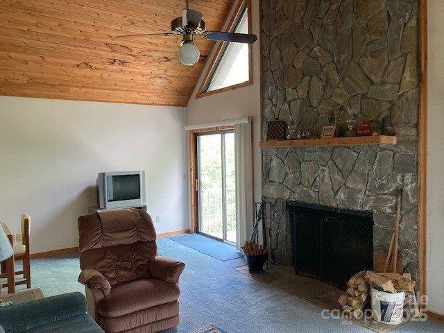 860 Pless Underwood Road Maggie Valley, NC 28751 - Photo 5 of 45 a living room with furniture and a fireplace