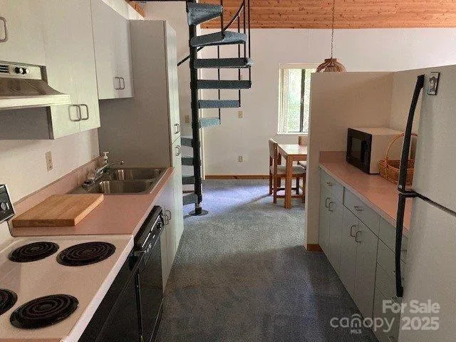 a kitchen with a stove and a refrigerator