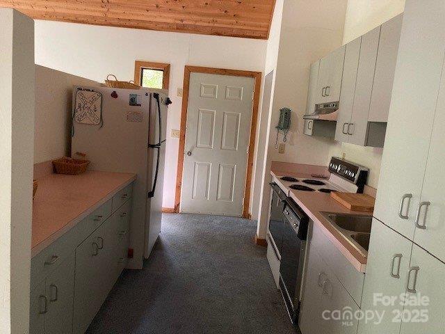860 Pless Underwood Road Maggie Valley, NC 28751 - Photo 10 of 45 a kitchen with a stove and a refrigerator