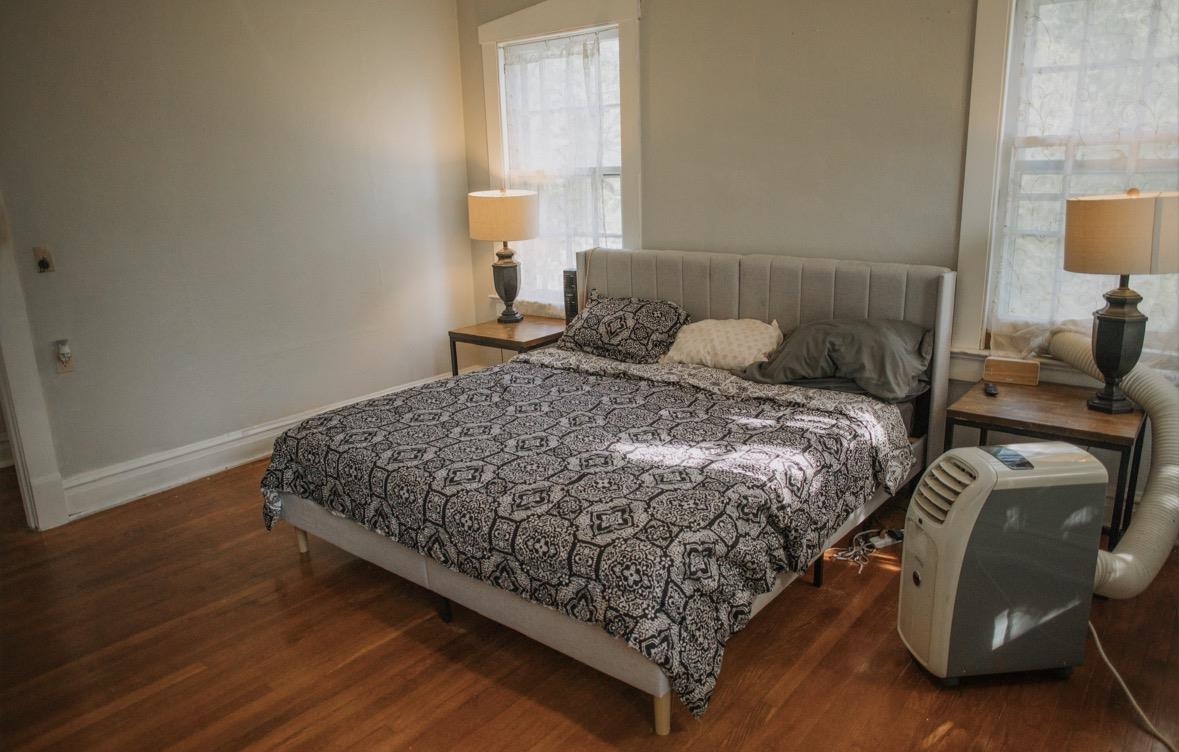 230 Lake Drive Ripley, TN 38063 - Photo 15 of 19 a bed sitting in a bedroom next to a lamp