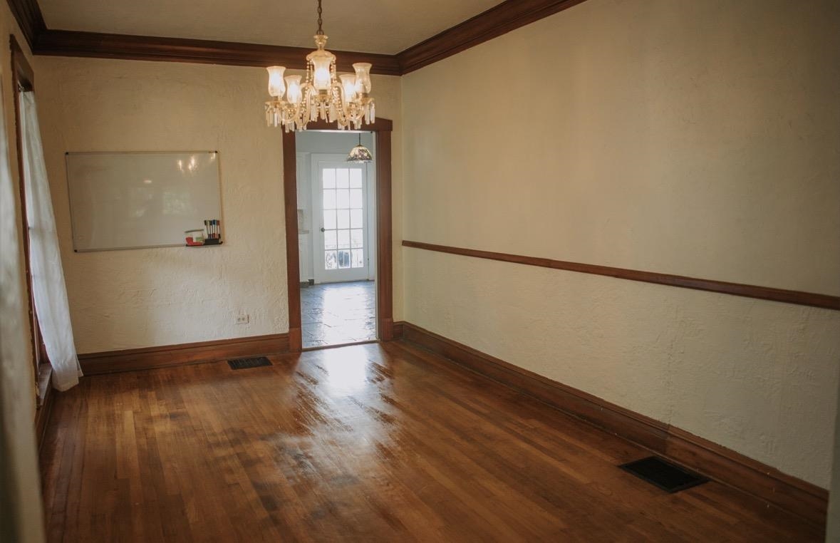 230 Lake Drive Ripley, TN 38063 - Photo 5 of 19 a view of a hallway with wooden floor and chandelier