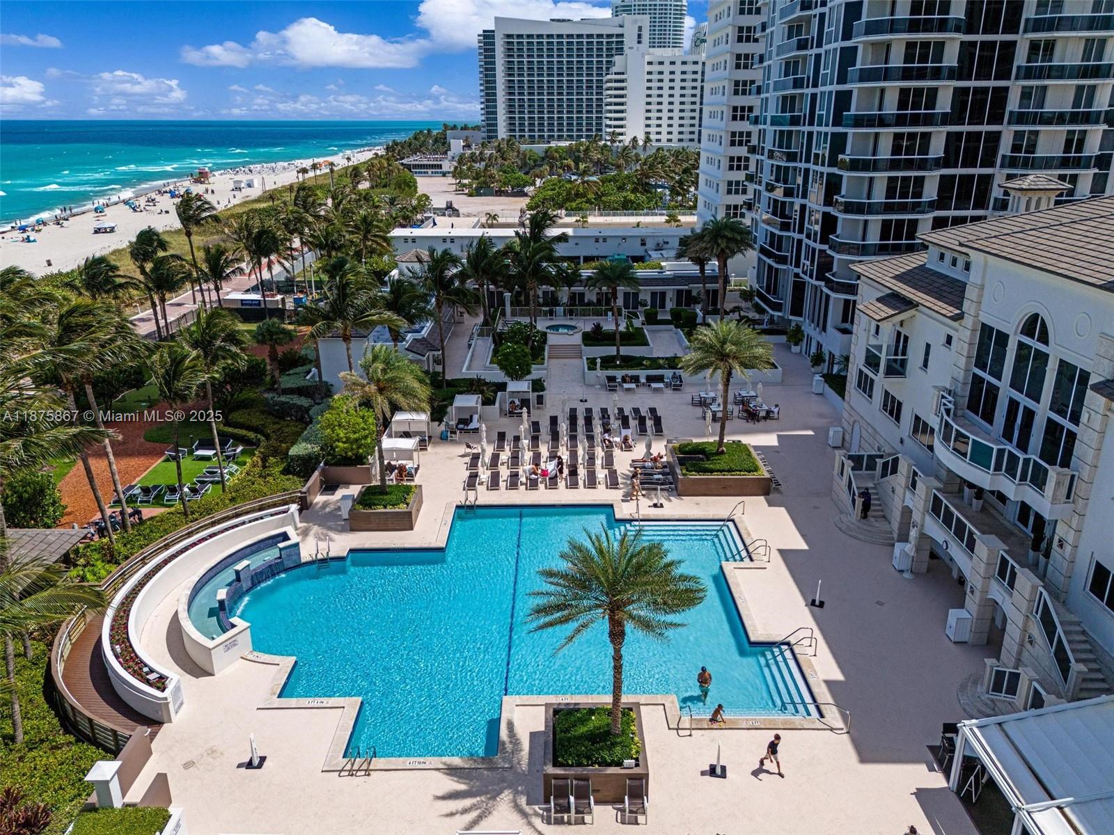 4779 Collins Avenue, Unit 2305 Miami Beach, FL 33140 - Photo 25 of 35 a view of swimming pool outdoor seating and city view