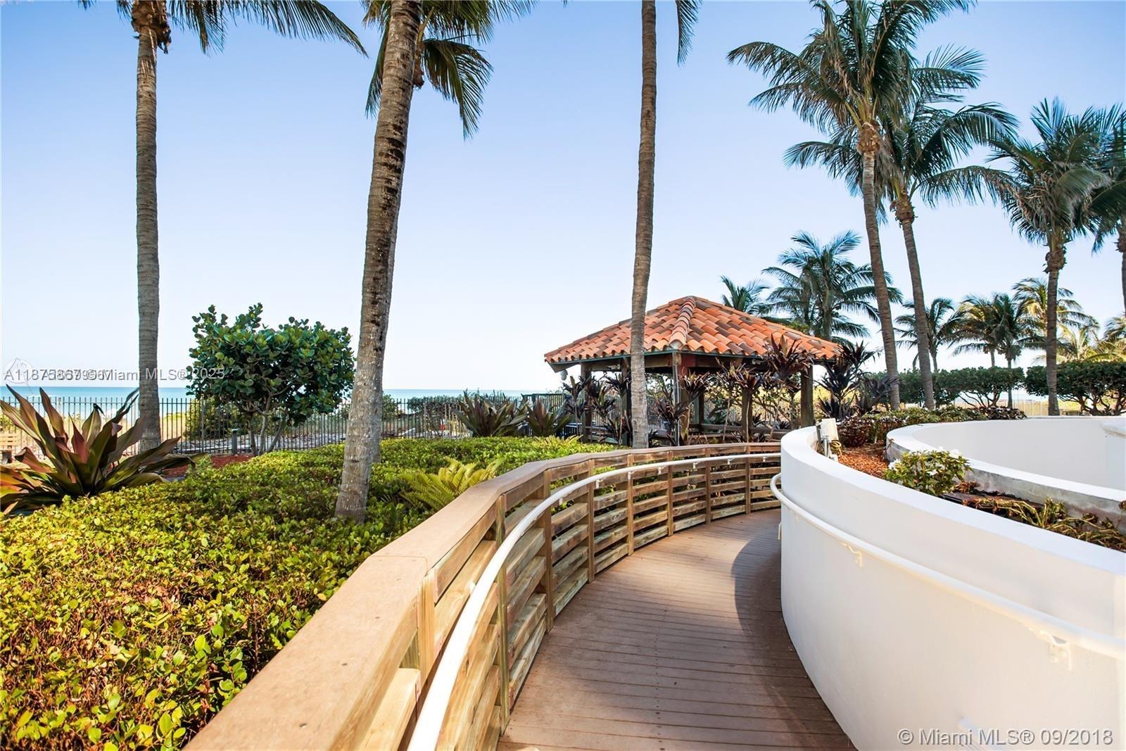 4779 Collins Avenue, Unit 2305 Miami Beach, FL 33140 - Photo 31 of 35 a view of a yard with potted plants