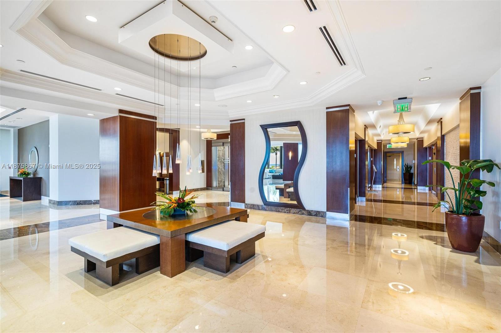 4779 Collins Avenue, Unit 2305 Miami Beach, FL 33140 - Photo 35 of 35 a living room with furniture and chandelier