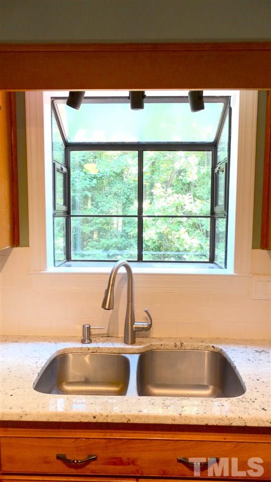 6812 Chasewick Circle Raleigh, NC 27615 - Photo 14 of 30 a view of sink and a microwave