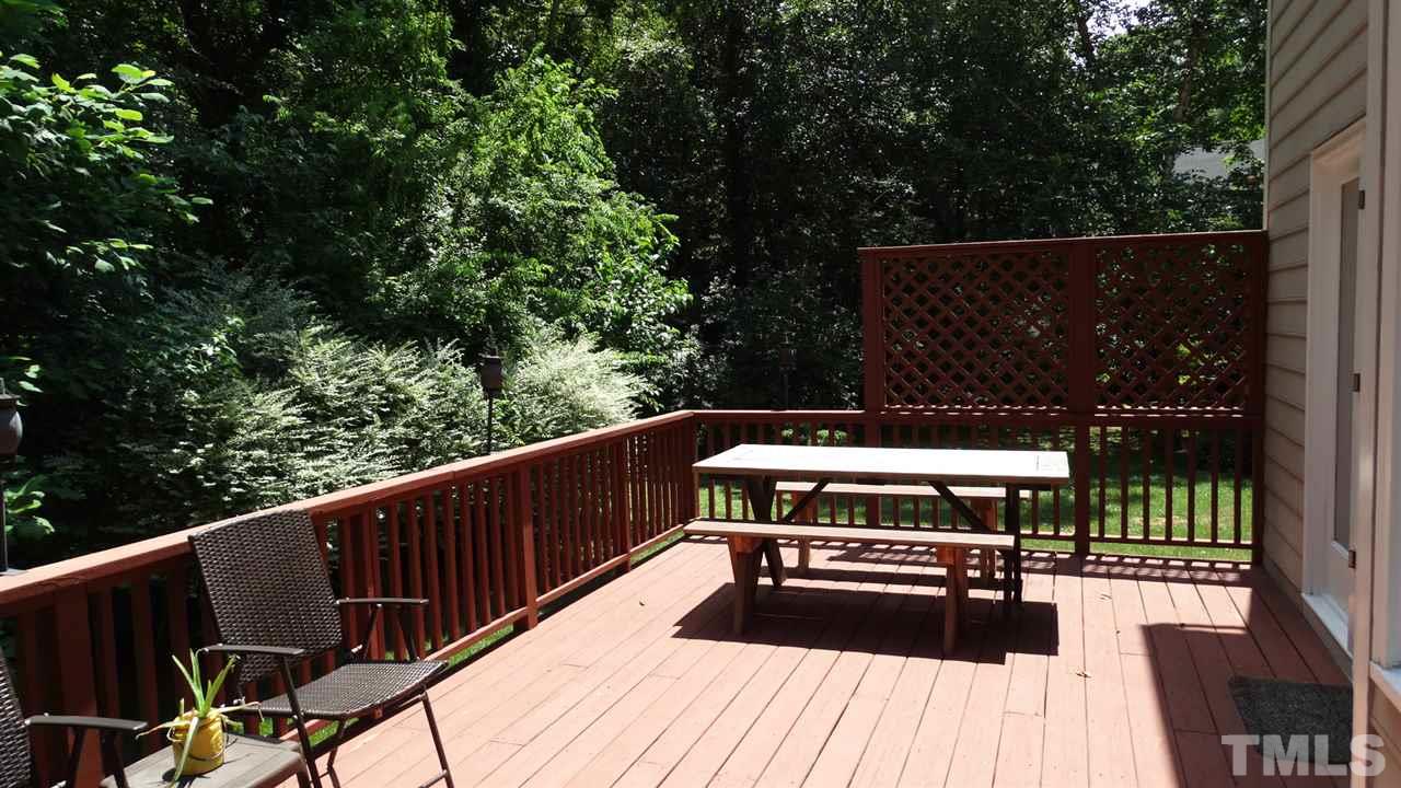 6812 Chasewick Circle Raleigh, NC 27615 - Photo 26 of 30 a view of balcony with wooden floor and outdoor seating