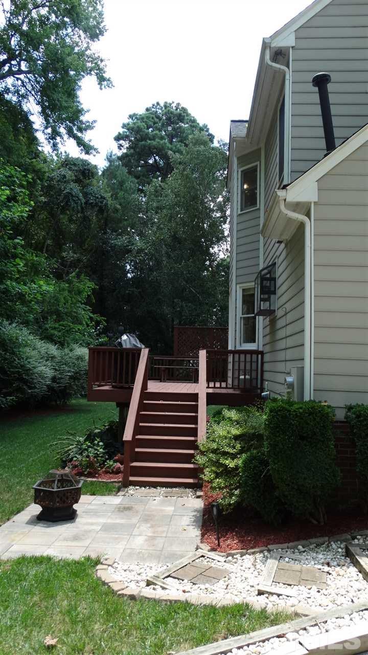 6812 Chasewick Circle Raleigh, NC 27615 - Photo 28 of 30 a backyard of a house with lots of green space
