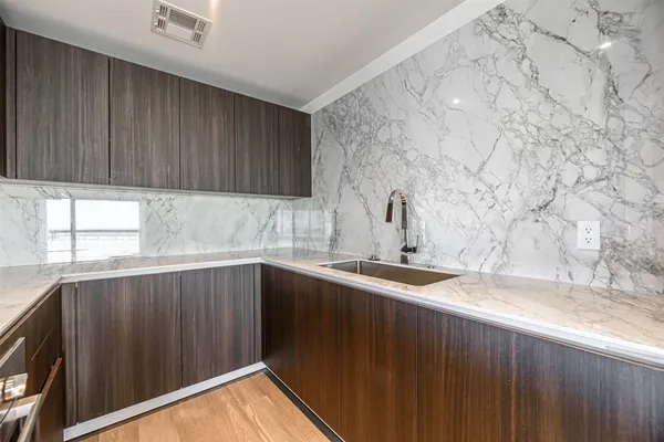 a kitchen with a sink and cabinets