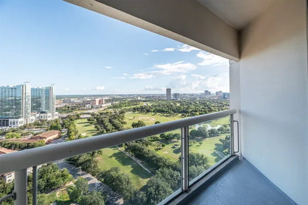 a view of a city skyline from a balcony