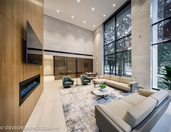 a living room with fireplace furniture and a flat screen tv