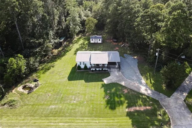 a view of a swimming pool with a yard