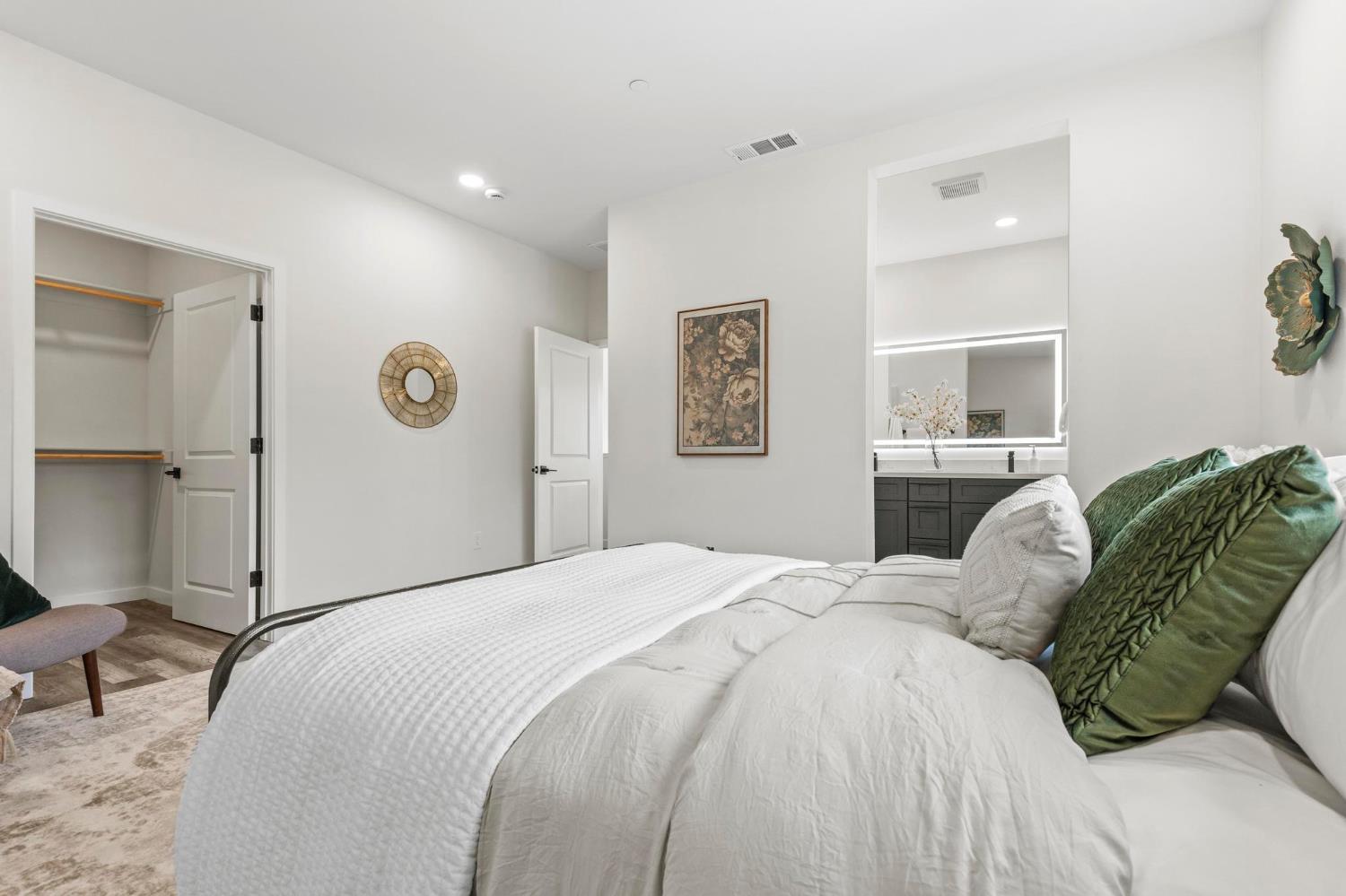 179 Park Circle Gridley, CA 95948 - Photo 20 of 57 a bedroom with a large bed and a chandelier