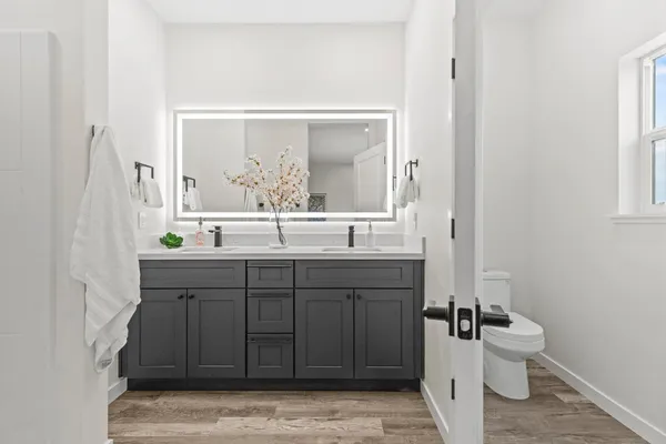 a bedroom with a bed and a toilet