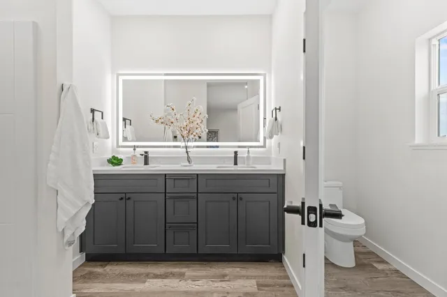 a bedroom with a bed and a toilet