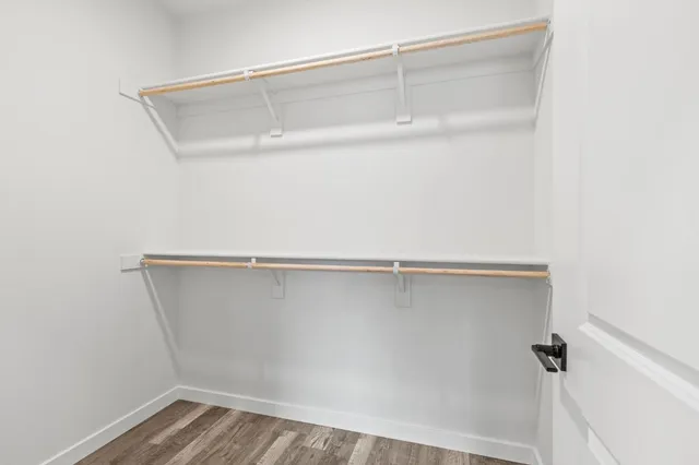 a kitchen with a window a sink and a refrigerator