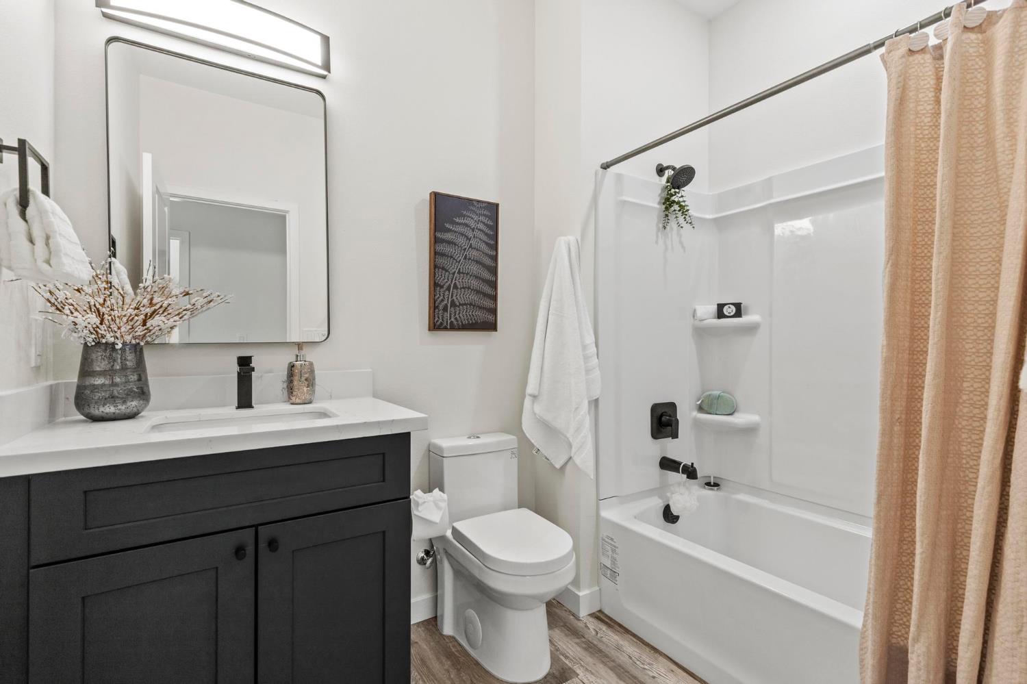 179 Park Circle Gridley, CA 95948 - Photo 29 of 57 a bathroom with a sink a toilet and shower