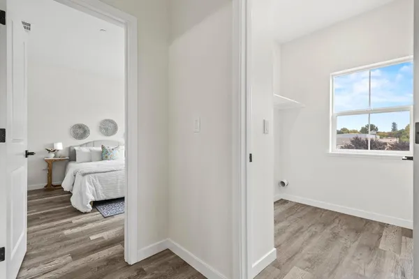 a bedroom with bed and a window