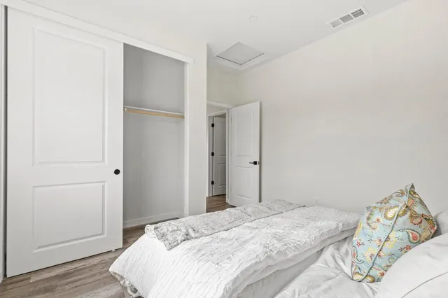 a view of a hallway with hallway and closet