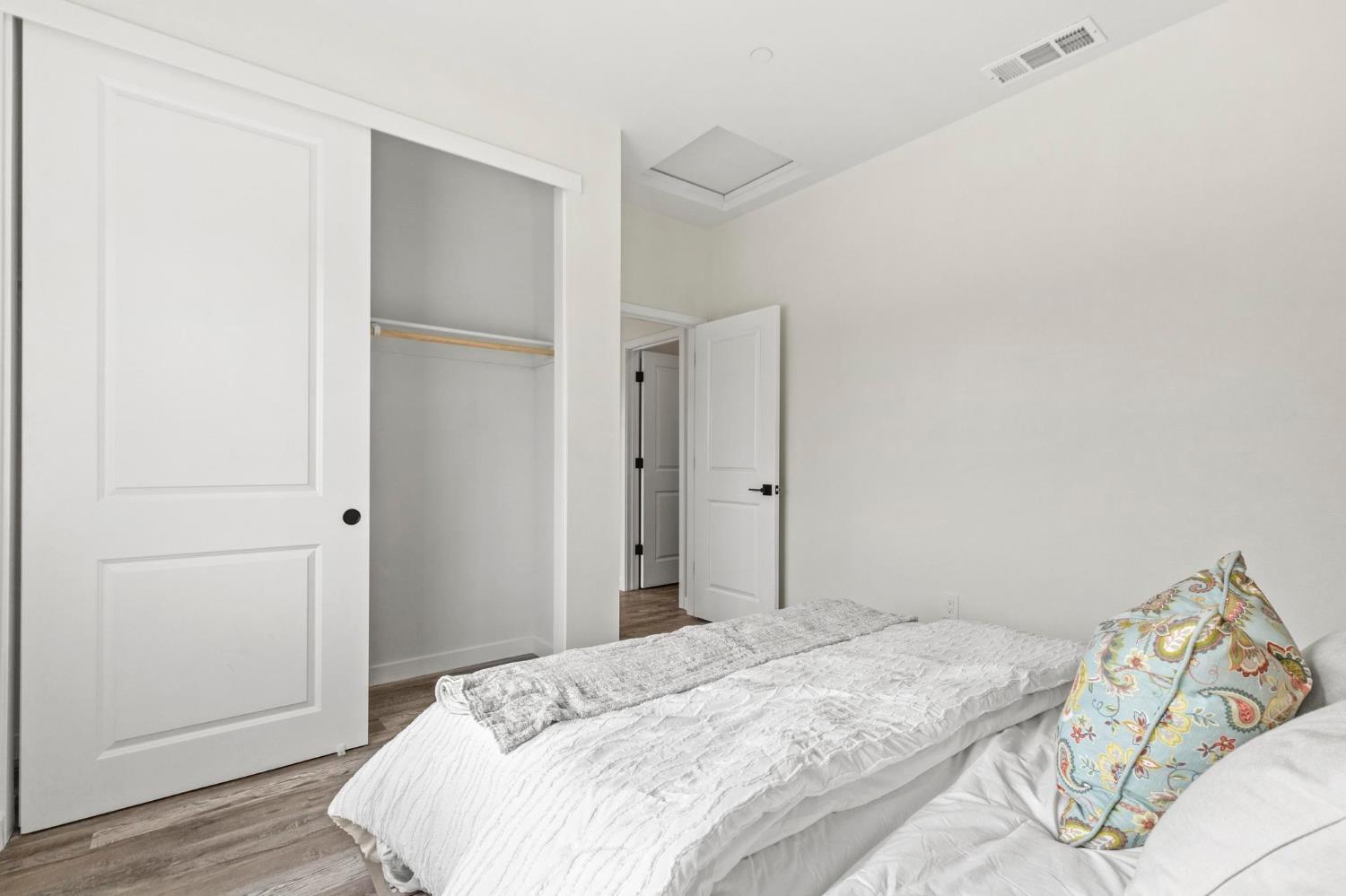 179 Park Circle Gridley, CA 95948 - Photo 33 of 57 a bedroom with a bed and wooden floor