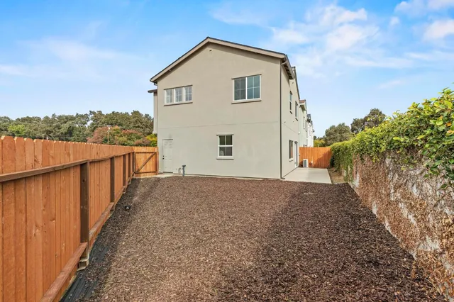 a view of living room with furniture and wooden floor
