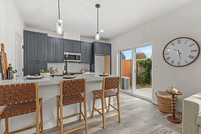 a kitchen with a sink stove and cabinets
