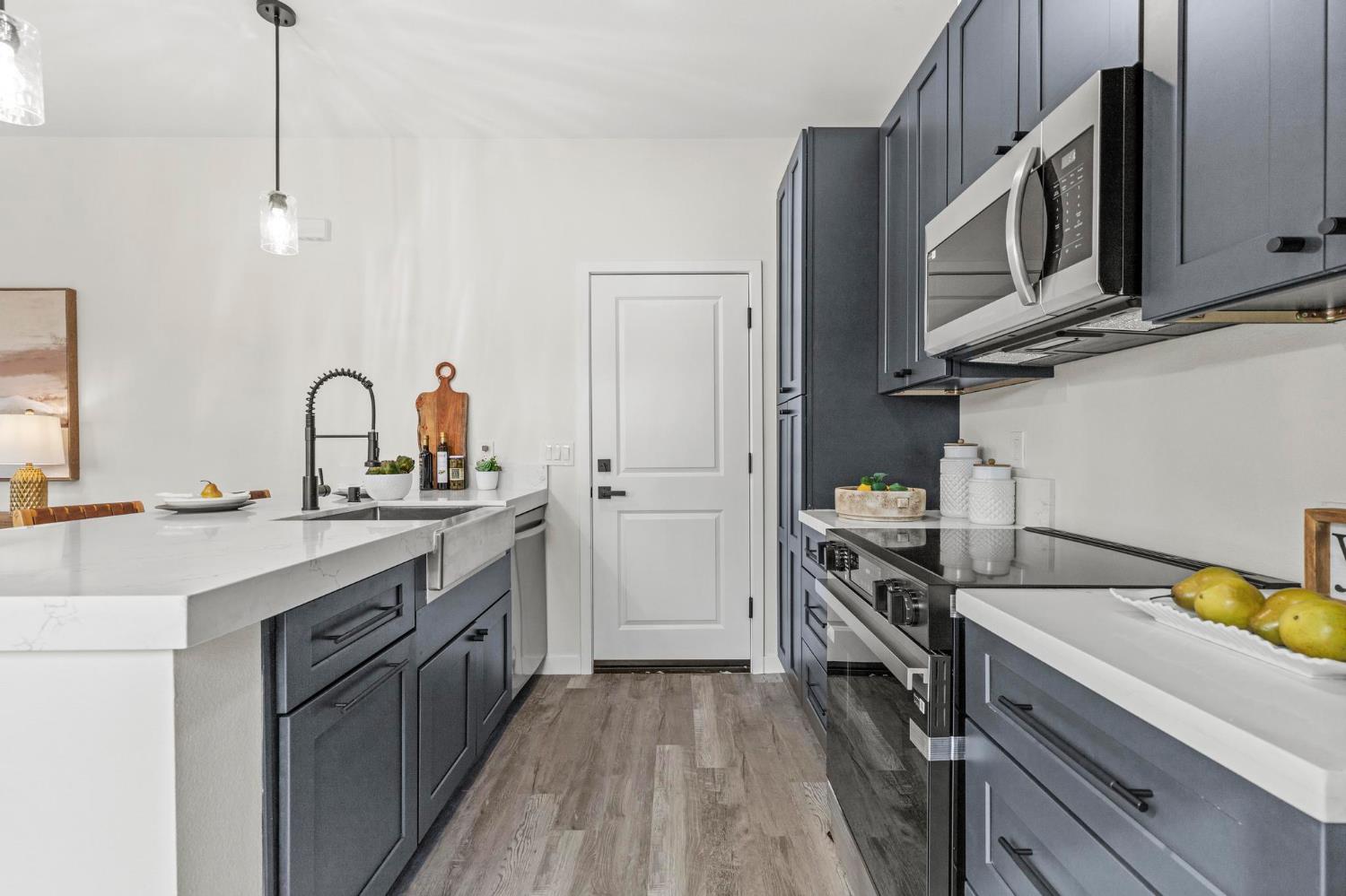 179 Park Circle Gridley, CA 95948 - Photo 9 of 57 a kitchen with a sink stove and cabinets
