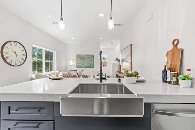 a living room with furniture and a rug